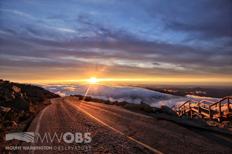 Late summer sunrise looking down the Mt. Washington Auto Road at the summit